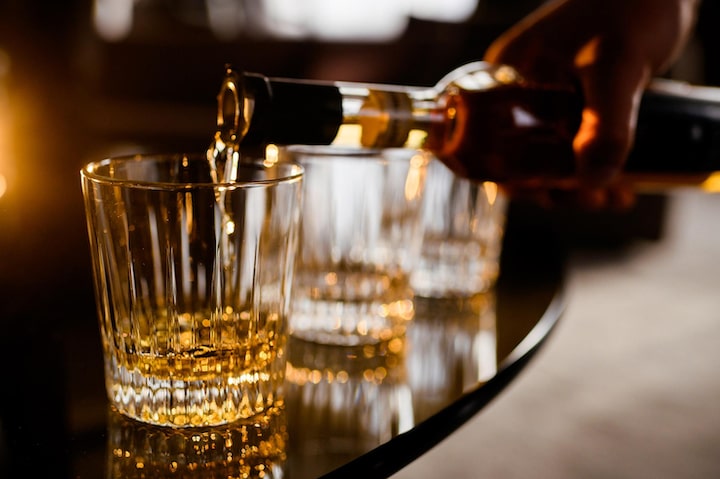 Beer, wine, and whiskey drinks representing worst foods to eat with diarrhea