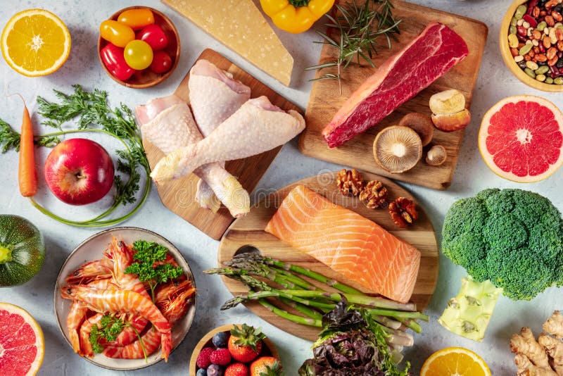 Ingredients for a balanced pescatarian meal plan including fish, vegetables, and grains.
