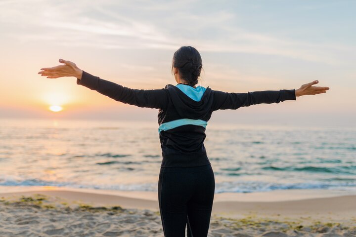 Morning stretching with natural sunlight to boost energy