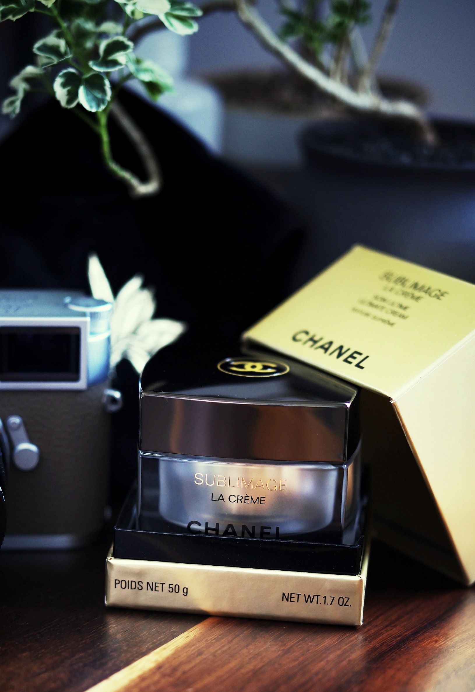 “Chanel Sublimage La Crème luxury anti-aging cream with golden glow effect.”